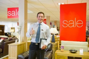 Salesman working in furniture store